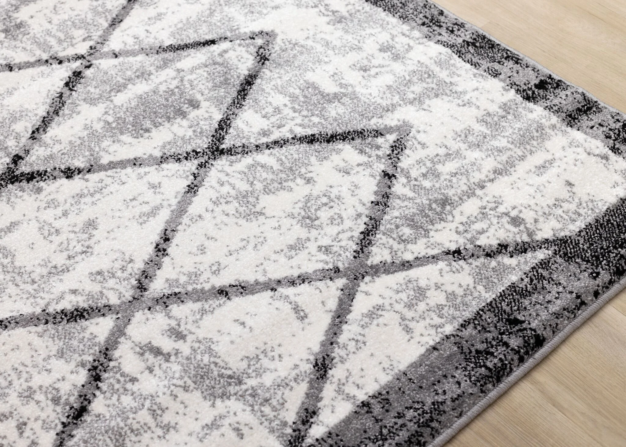 Ashwood 5'3" x 7'7" Distressed Lattice Area Rug - Grey, Black, White - Image 4