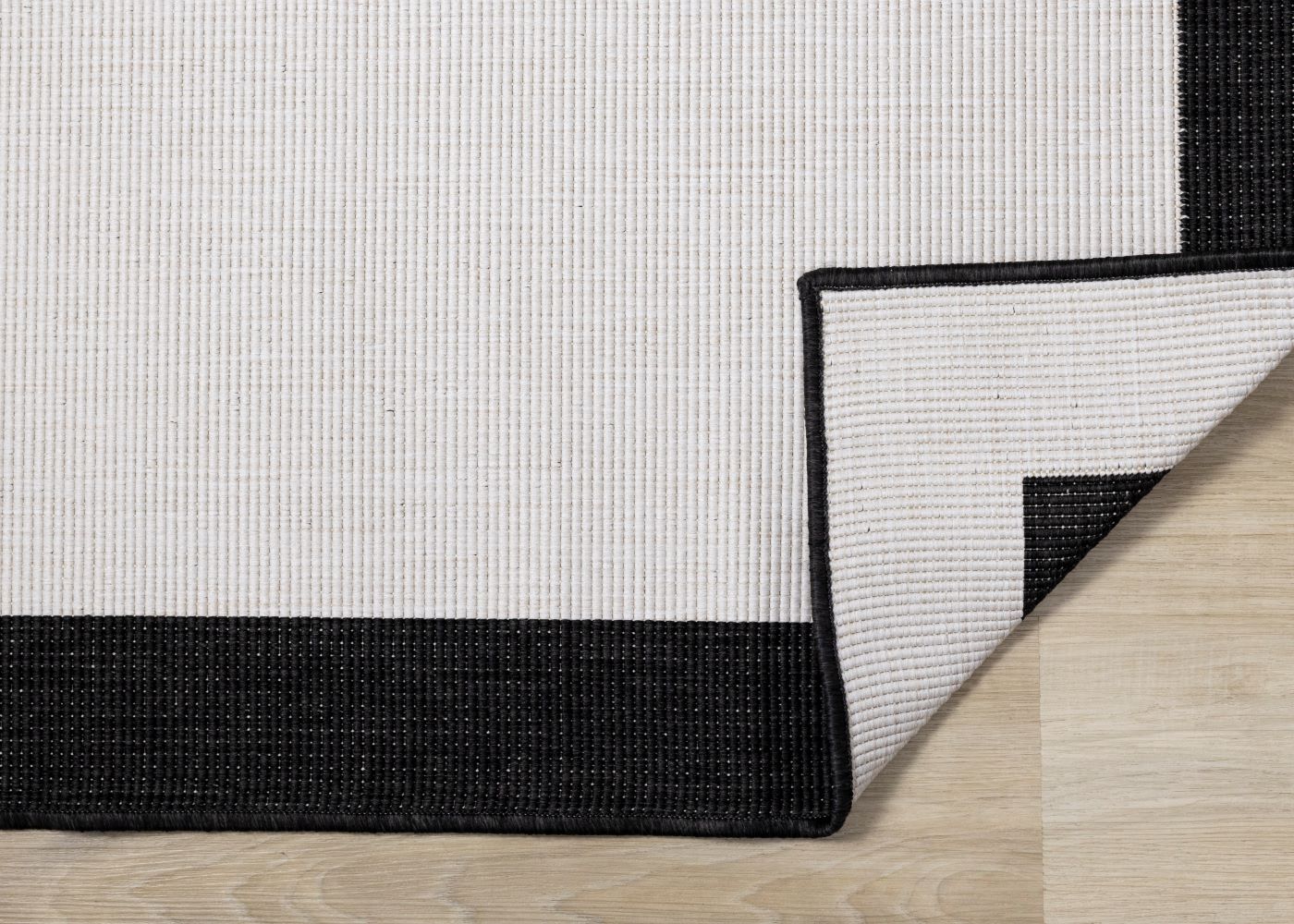 Summer Breeze 6'7" x 9'6" Reversible Outdoor Rug - Cream, Black Border - Image 4